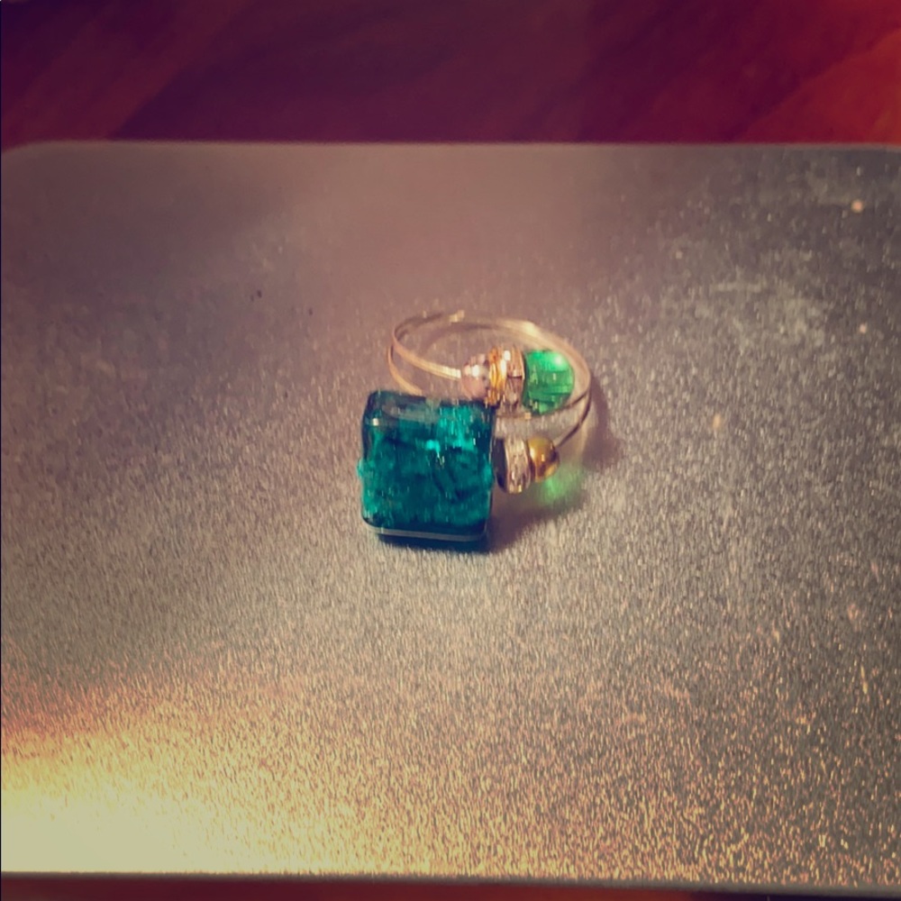 silver expandable band ring with green stone